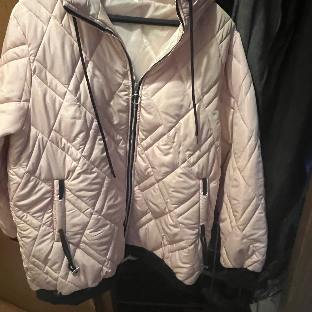 Adorable lightweightght jacket in a creamy pink color withh black trim.